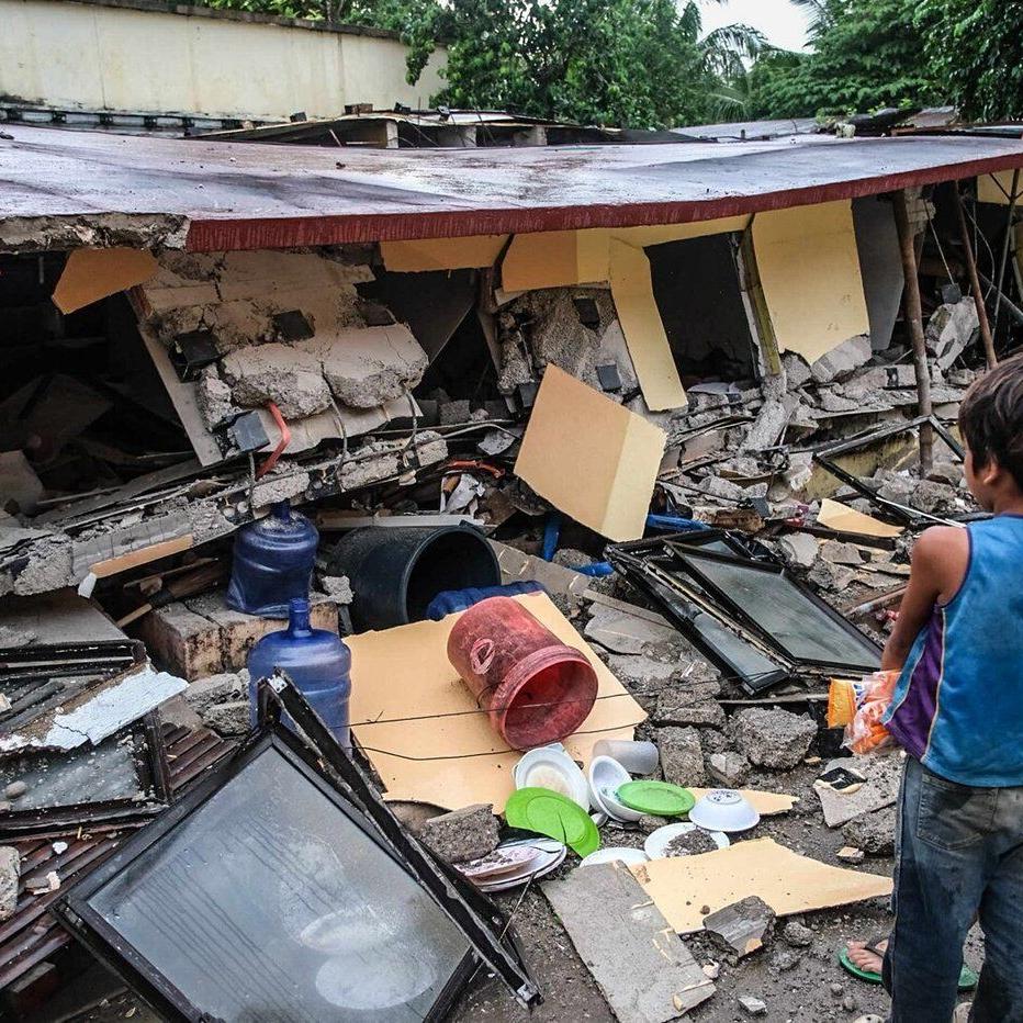 Rescuers desperately search for survivors of earthquake in the Philippines that killed at least 72